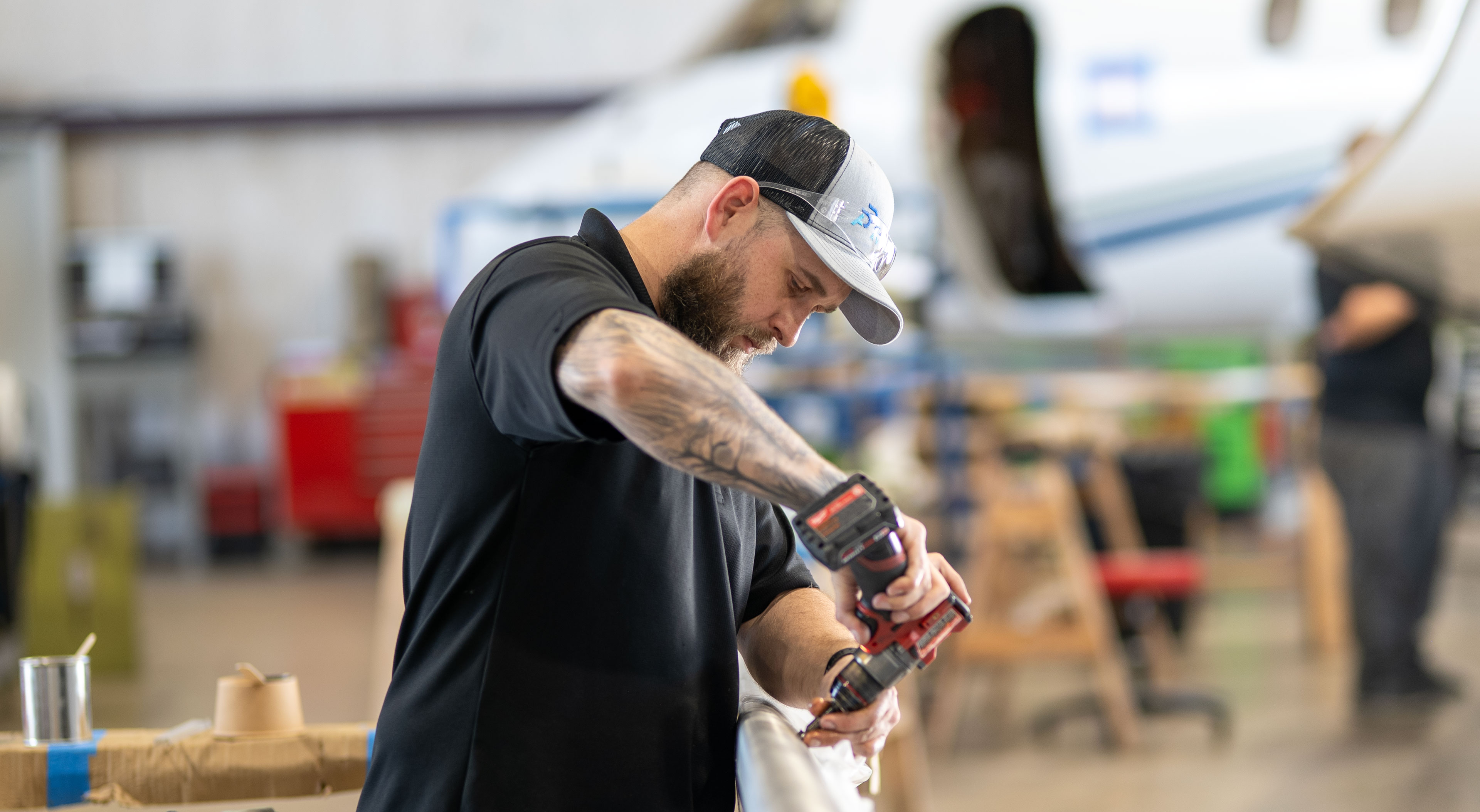 Technician working on aircraft wing