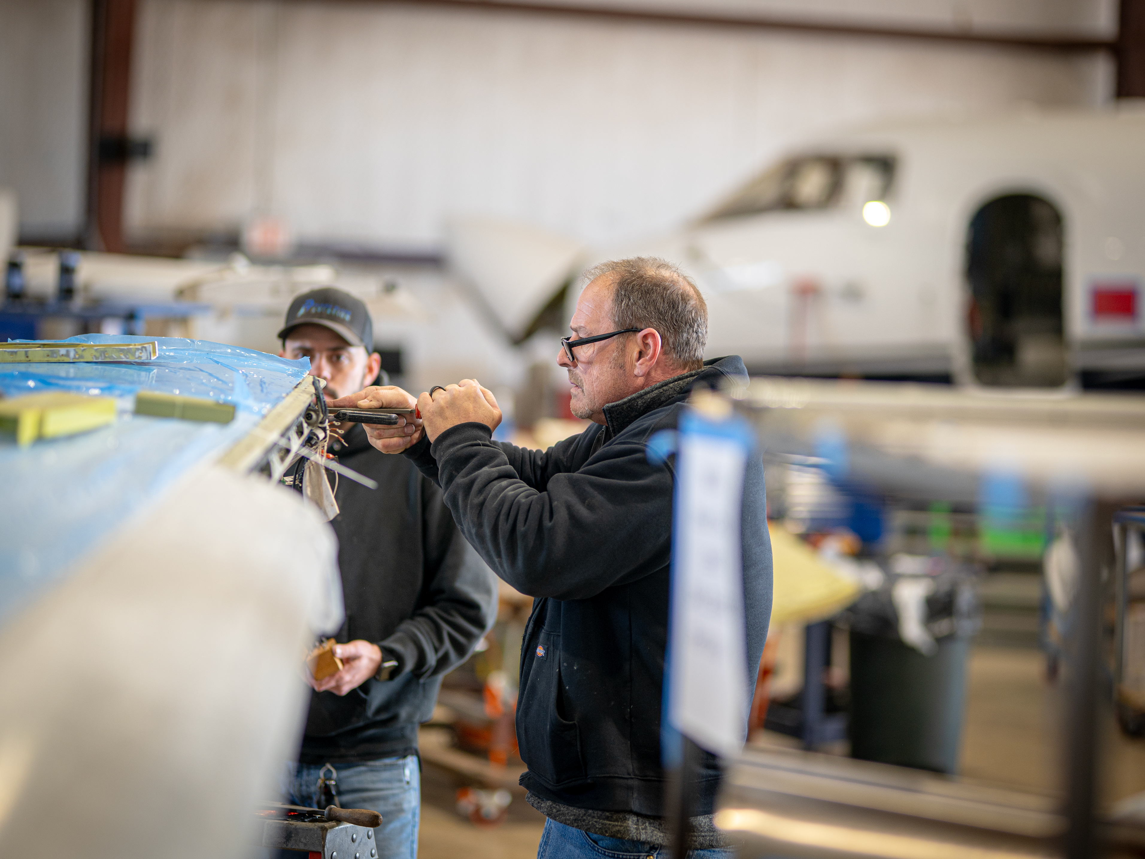 Plane Place Aviation technician James performing detailed winglet work