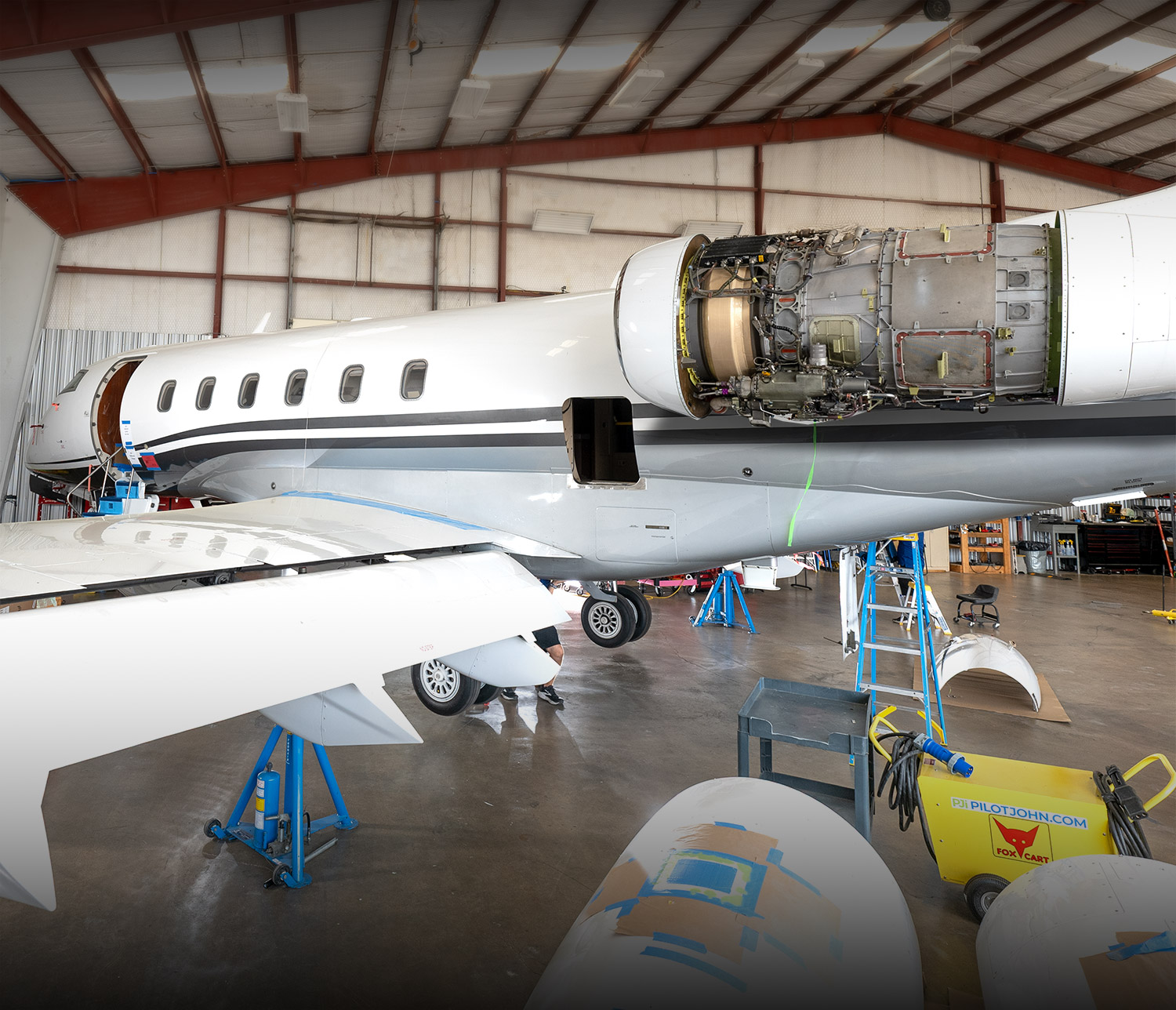 Challenger aircraft in the Plane Place Aviation shop undergoing maintenance