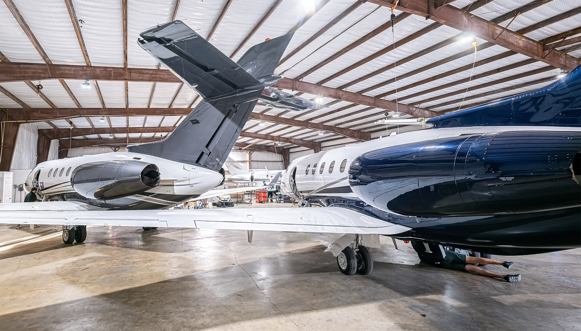 Plane Place Aviation hangar in Cleburne with a Hawker on the floor